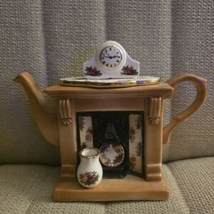 Vintage 1996 miniature tea pot shaped like fireplace. Handcrafted by Paul Cardew